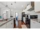Contemporary kitchen showcasing granite countertops, stainless steel appliances, ample storage, and modern fixtures at 4607 Underwood Walk, Powder Springs, GA 30127