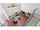Aerial view of a living room with hardwood floors, high ceilings, and a staircase at 4607 Underwood Walk, Powder Springs, GA 30127