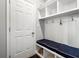 Mudroom with built in cubbies and a bench seat along with coat hooks and shoe storage at 4607 Underwood Walk, Powder Springs, GA 30127