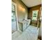 Elegant bathroom featuring marble countertops, vanity with drawers, and decorative light fixtures at 1111 Lake Varner Dr, Covington, GA 30014