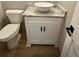 Bathroom with white vanity and vessel sink with gray veined countertop at 1111 Lake Varner Dr, Covington, GA 30014