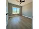 Bedroom with wood floors and large windows showing country views at 1111 Lake Varner Dr, Covington, GA 30014
