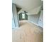 Spacious unfinished bedroom with a ceiling fan and large window views at 1111 Lake Varner Dr, Covington, GA 30014