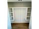 Spacious closet with built-in shelving and modern wood flooring at 1111 Lake Varner Dr, Covington, GA 30014