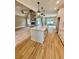 Kitchen open to the living area with an island, stone fireplace, and stainless steel appliances at 1111 Lake Varner Dr, Covington, GA 30014