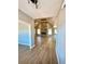 Living room with vaulted ceilings, hardwood floors, a stone fireplace and ample natural light at 1111 Lake Varner Dr, Covington, GA 30014
