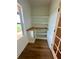 Cozy office nook with built-in desk, floating shelves, wood-look flooring, and natural light at 1111 Lake Varner Dr, Covington, GA 30014