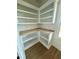 Corner office space featuring built-in shelving, light wood countertops, and wood-look flooring at 1111 Lake Varner Dr, Covington, GA 30014