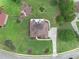 Aerial view showcasing the home's manicured lawn and circular driveway at 127 Courts Of Hampton, Hampton, GA 30228