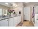 Spacious bathroom with granite counters, white cabinets, double sinks, and a separate shower at 127 Courts Of Hampton, Hampton, GA 30228