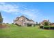 Expansive property featuring well-maintained lawn and large deck perfect for relaxation and entertainment at 127 Courts Of Hampton, Hampton, GA 30228