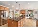 Spacious kitchen with a large center island, stainless steel appliances, and tiled flooring at 127 Courts Of Hampton, Hampton, GA 30228