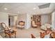 Basement sitting room with neutral walls, comfortable furniture, and bright lighting at 127 Courts Of Hampton, Hampton, GA 30228