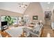 Spacious living room with large windows, hardwood floors, and neutral decor at 127 Courts Of Hampton, Hampton, GA 30228