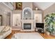 Open living room offers fireplace, hardwood floors, and ample natural light at 127 Courts Of Hampton, Hampton, GA 30228