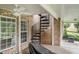 View of the covered patio, featuring spiral staircase and brick facade, great for entertaining at 127 Courts Of Hampton, Hampton, GA 30228