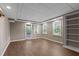 Finished basement with a walkout door, natural light, and built-in shelves at 2120 Habersham Trce, Cumming, GA 30041