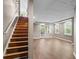 Finished basement with a walkout, natural light, and wood stairs at 2120 Habersham Trce, Cumming, GA 30041