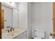 Bathroom featuring a mirror, toilet, sink and vanity with ample counter space at 2120 Habersham Trce, Cumming, GA 30041