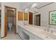 Bathroom featuring double sinks and a vanity with plenty of natural light at 2120 Habersham Trce, Cumming, GA 30041