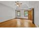Large bedroom with hardwood floors, a ceiling fan, and lots of natural light at 2120 Habersham Trce, Cumming, GA 30041