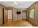 Bedroom with a closet, and hardwood floors, featuring natural light from the window at 2120 Habersham Trce, Cumming, GA 30041