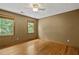 Bedroom with hardwood floors and two windows providing ample natural light at 2120 Habersham Trce, Cumming, GA 30041