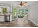 Sunlit breakfast nook featuring large windows with views of the backyard at 2120 Habersham Trce, Cumming, GA 30041