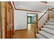 Welcoming foyer with hardwood floors, staircase, and access to the living room at 2120 Habersham Trce, Cumming, GA 30041