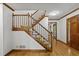 Open foyer showcasing hardwood floors, staircase, and view of adjacent rooms at 2120 Habersham Trce, Cumming, GA 30041
