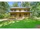 Charming two-story home featuring a welcoming front porch and manicured lawn surrounded by lush trees at 2120 Habersham Trce, Cumming, GA 30041