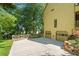 Two-car garage with an expansive driveway and well-manicured landscaping at 2120 Habersham Trce, Cumming, GA 30041