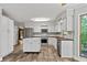 Spacious kitchen with an island, stainless steel appliances, and wood-look flooring at 2120 Habersham Trce, Cumming, GA 30041
