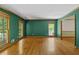 Spacious living room with hardwood floors, decorative trim, and large windows providing ample natural light at 2120 Habersham Trce, Cumming, GA 30041