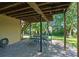 Covered patio features an outdoor dining area with a stone floor at 2120 Habersham Trce, Cumming, GA 30041