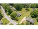 Aerial view of the property featuring its well-manicured lawn, mature trees, and desirable neighborhood location at 2675 Springside Ct, Douglasville, GA 30135