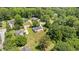 Aerial view of the property showcasing its spacious backyard, mature trees, and proximity to neighborhood amenities at 2675 Springside Ct, Douglasville, GA 30135