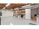 Spacious unfinished basement with exposed wood ceilings, concrete floor, and abundant storage potential at 2675 Springside Ct, Douglasville, GA 30135