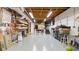 Large unfinished basement with bright lighting, storage shelves, and ample space for customization at 2675 Springside Ct, Douglasville, GA 30135