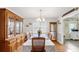 Traditional dining room with a large hutch, chandelier lighting, and a table set for Gathering dining at 2675 Springside Ct, Douglasville, GA 30135
