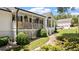 Charming home featuring a covered front porch, well-manicured landscaping, and a welcoming walkway at 2675 Springside Ct, Douglasville, GA 30135