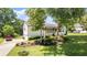 Well-maintained home exterior featuring a classic white facade, inviting porch, and a beautifully landscaped front yard at 2675 Springside Ct, Douglasville, GA 30135