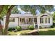 Charming home with a welcoming front porch, landscaped yard and classic white siding and black shutters at 2675 Springside Ct, Douglasville, GA 30135