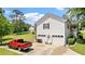 Spacious home with an attached two-car garage, a well-kept lawn, and access to a cozy front porch at 2675 Springside Ct, Douglasville, GA 30135