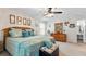 Bright main bedroom featuring carpet, soft, natural light and a comfortable bed at 2675 Springside Ct, Douglasville, GA 30135