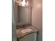 Bathroom vanity with granite countertop, stylish mirror, and modern lighting fixture at 3773 Summer Rose Dr, Atlanta, GA 30341