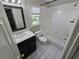 Bathroom featuring a shower-tub combo, and classic white tile flooring at 3773 Summer Rose Dr, Atlanta, GA 30341