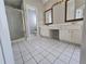 Spacious bathroom featuring double vanity, glass enclosed shower and tile flooring at 3773 Summer Rose Dr, Atlanta, GA 30341