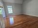 Cozy bedroom with hardwood floors, neutral paint, and natural light from window at 3773 Summer Rose Dr, Atlanta, GA 30341