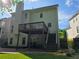 Back exterior of home with a deck, patio, and lush greenery at 3773 Summer Rose Dr, Atlanta, GA 30341